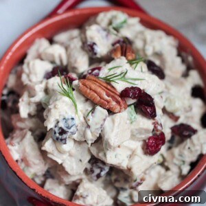 cranberry pecan chicken salad in a red bowl.