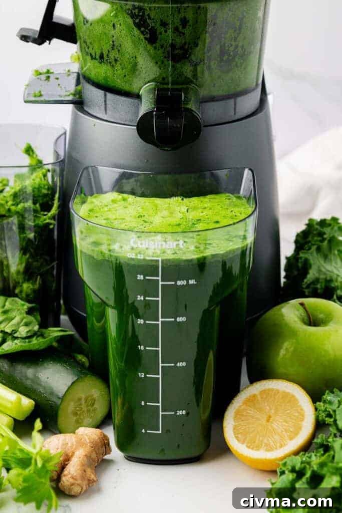 green juice next to a juicer