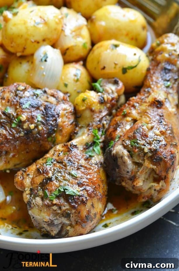 instant pot chicken drumsticks and baby potatoes in a white plate with sauce