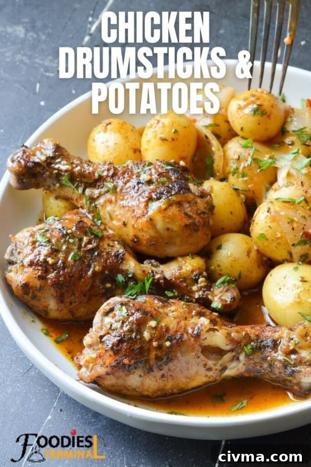 pressure cooker chicken drumsticks and potatoes in a white plate and a fork being inserted in a baby potato