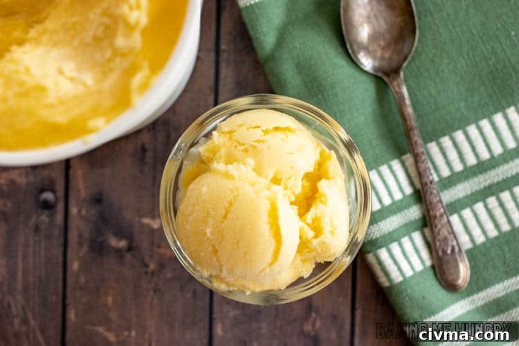 Creamy Mango Coconut Ice Cream Recipe 13 coconut milk mango ice cream in small glass bowl