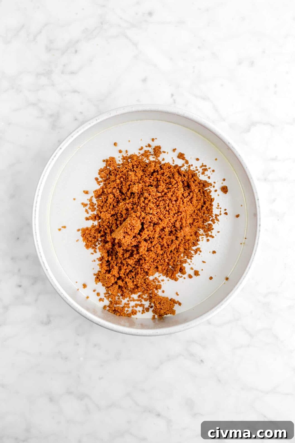 gingerbread cookie crumbs in cake pan