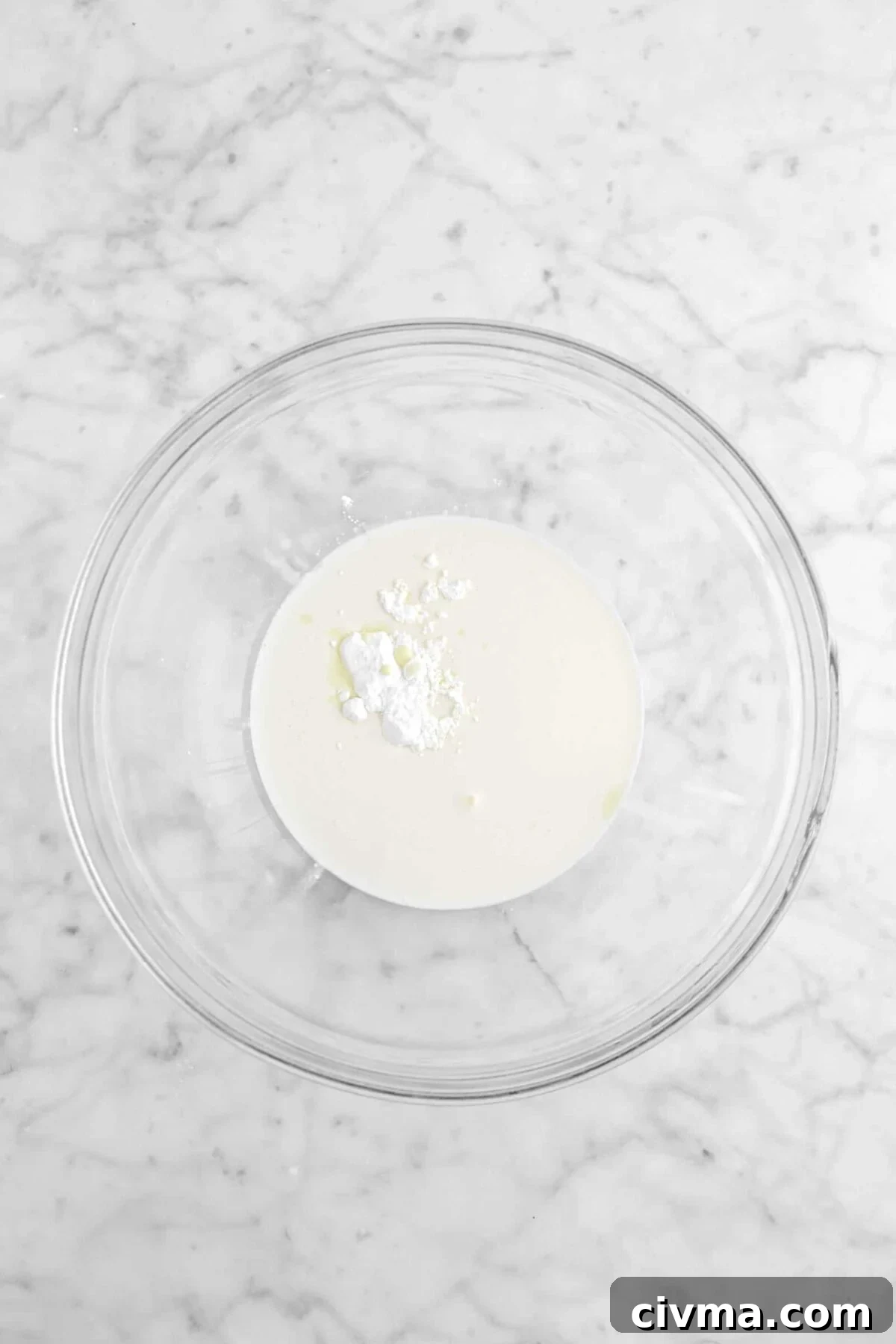 heavy cream, eggnog, and powdered sugar in glass bowl