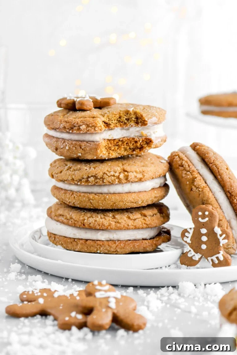 three stacked sandwich cookies with top cookie missing a bite.