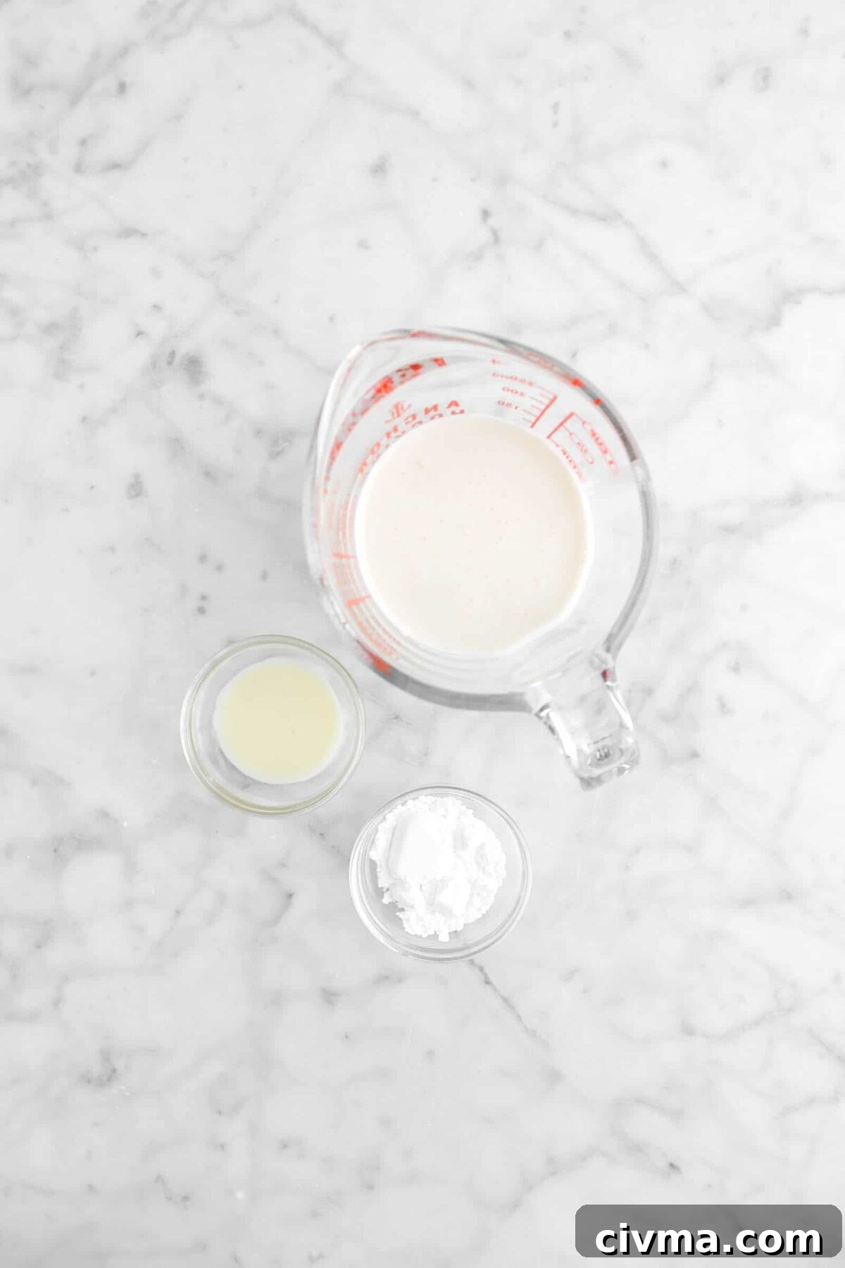 heavy cream, eggnog, and powdered sugar on marble counter
