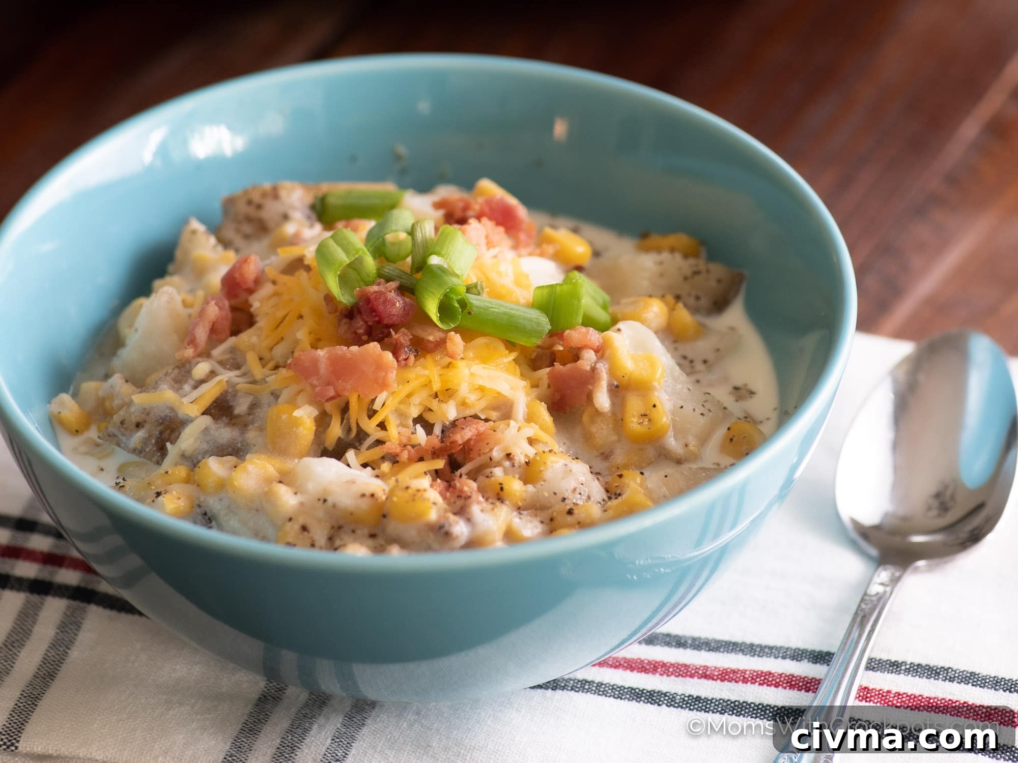 Crock Pot Bacon Corn Chowder topped with cheese and green onion