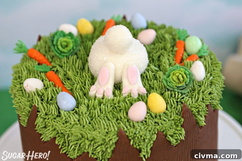 Close-up of the top of the Chocolate Easter Bunny Cake, with a fondant bunny butt and fondant carrots and cabbages