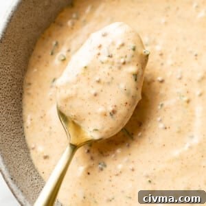 a bowl of remoulade sauce with a spoon