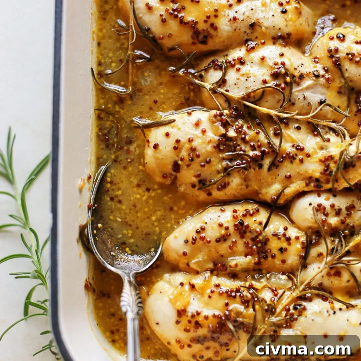 photo of honey mustard chicken in a white baking dish