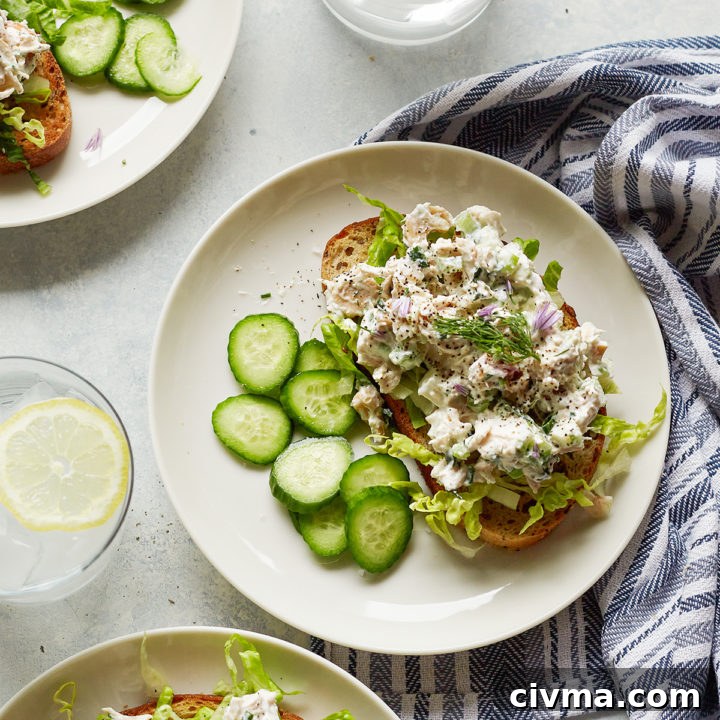 overhead photo of greek yogurt chicken salad with green apples on white plates