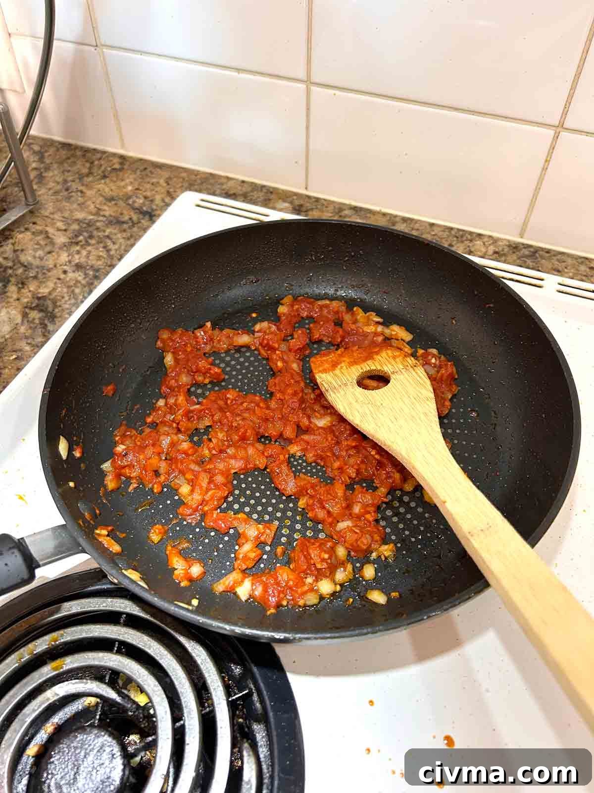 tomato paste added to pan.