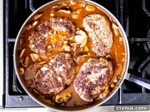 Step 8 how to make salisbury steak, Nestled the meat patties into the sauce. Cover and continue to cook.