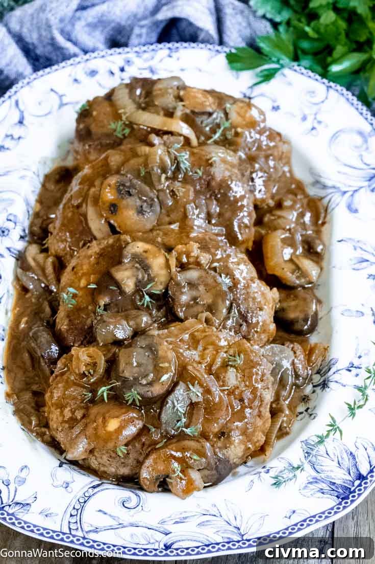 salisbury steak with onion gravy in a serving dish