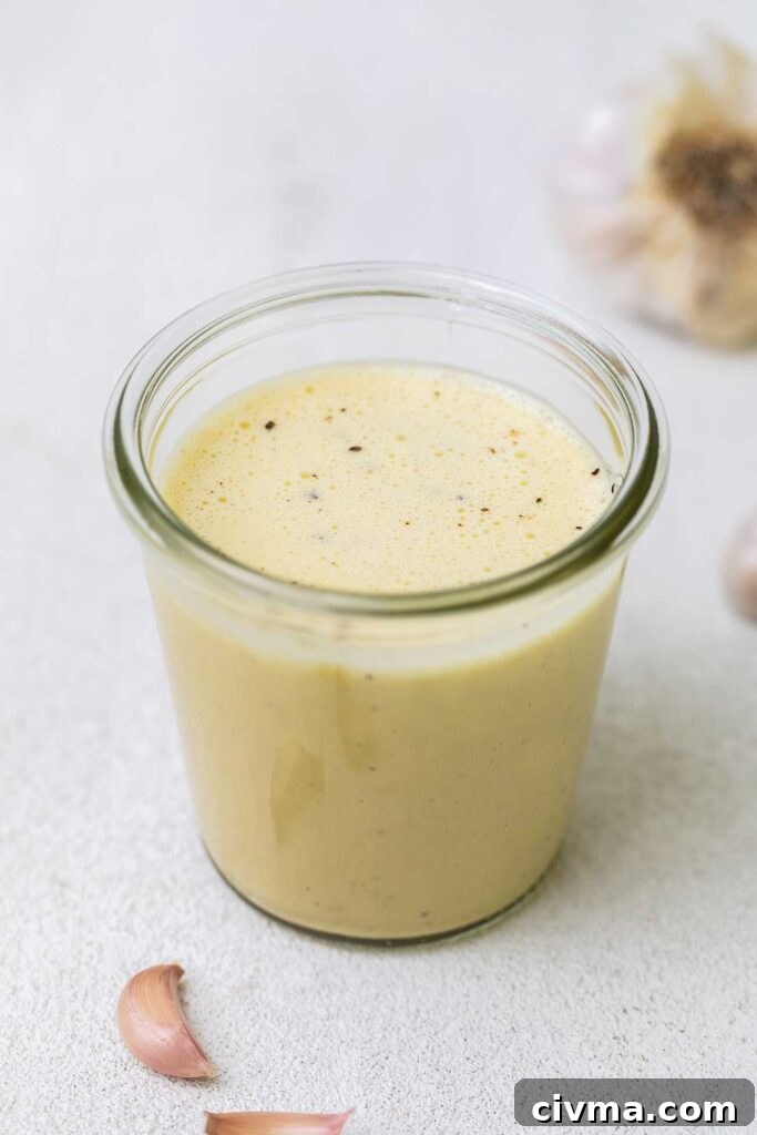 A jar of a homemade caesar dressing.