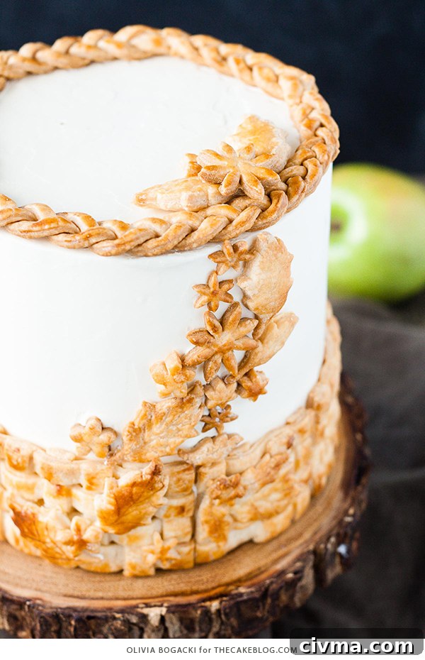 Apple Pie Cake with cinnamon, nutmeg, fresh apple pie filling, buttercream frosting, and braided pie crust lattice