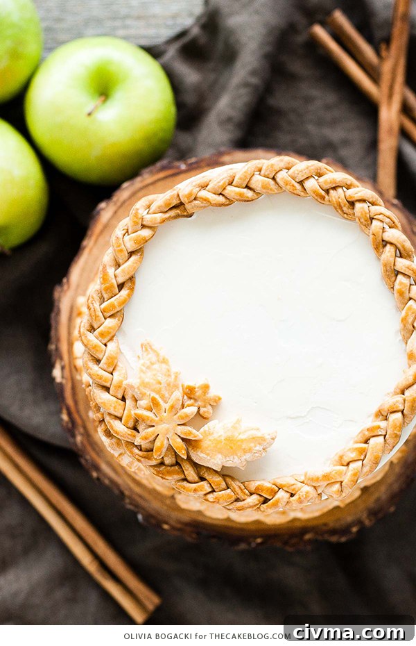 Apple Pie Cake with cinnamon, nutmeg, fresh apple pie filling, buttercream frosting, and braided pie crust lattice