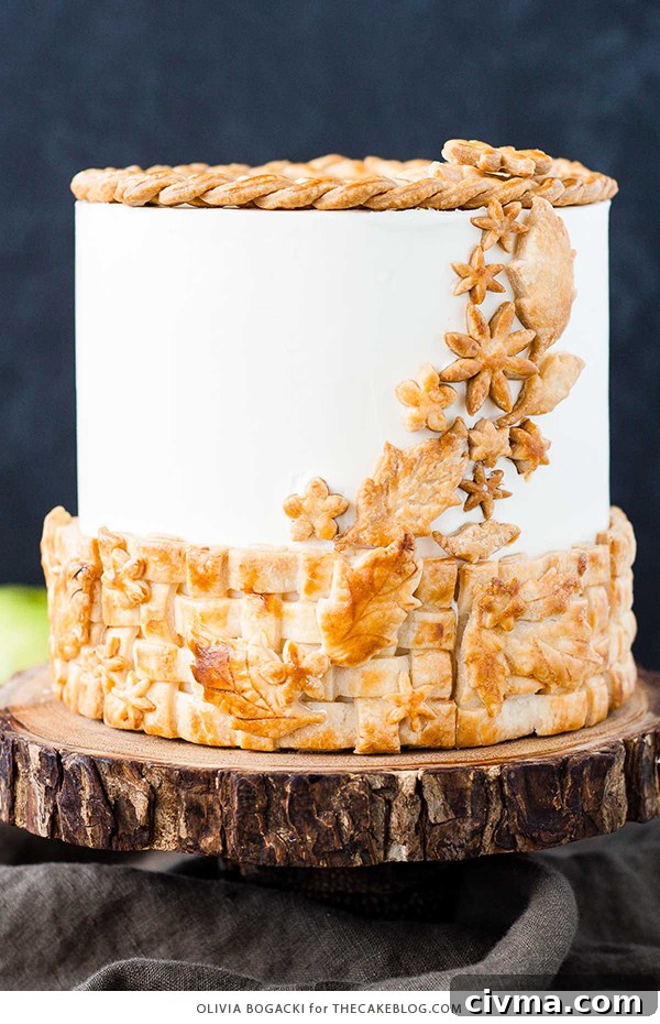 Apple Pie Cake with cinnamon, nutmeg, fresh apple pie filling, buttercream frosting, and braided pie crust lattice