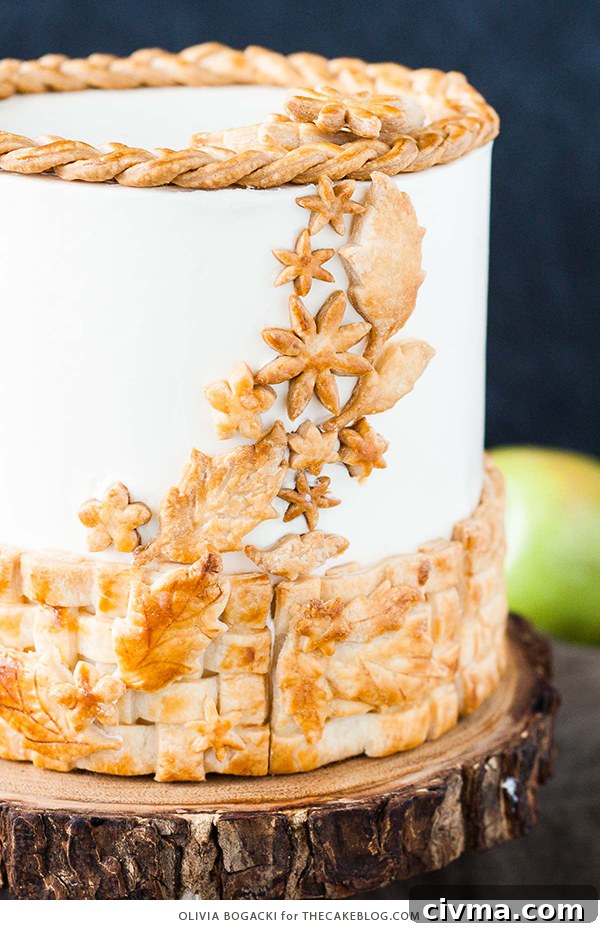 Apple Pie Cake with cinnamon, nutmeg, fresh apple pie filling, buttercream frosting, and braided pie crust lattice