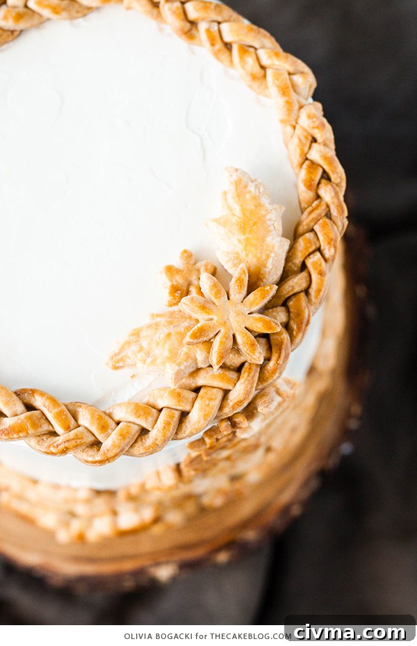 Apple Pie Cake with cinnamon, nutmeg, fresh apple pie filling, buttercream frosting, and braided pie crust lattice