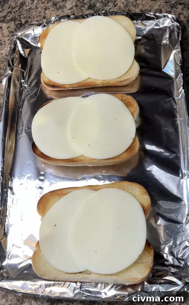 Melted cheese on rolls for Italian Beef Sandwiches