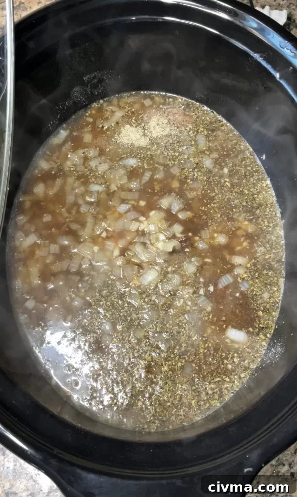Beef broth added to crockpot Italian beef