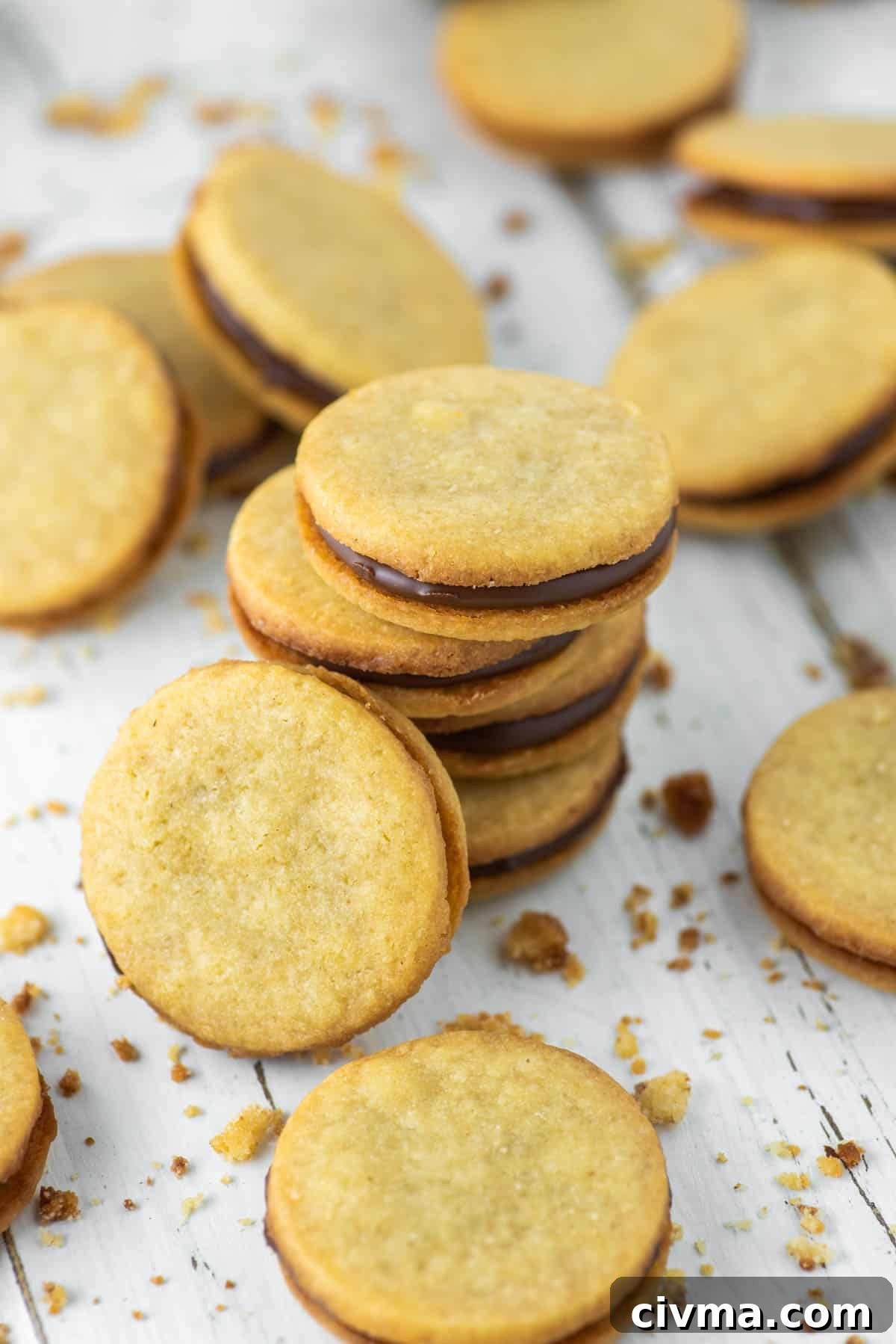 Nutella Stuffed Cookies Recipe 3 nutella biscuits stacked on a white board