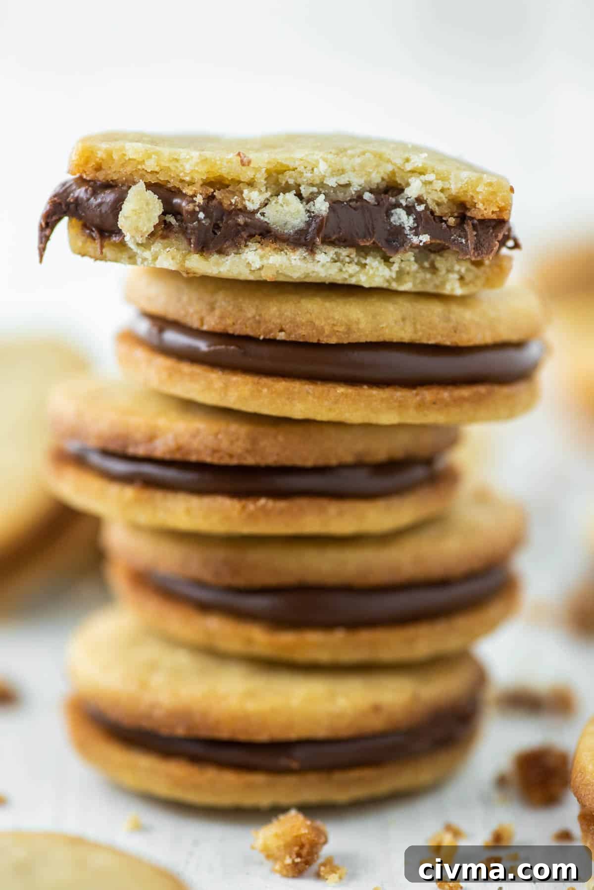 Nutella Stuffed Cookies Recipe 6 nutella biscuit bitten in half and on top of four others