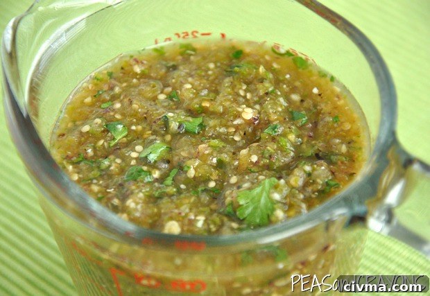 Homemade roasted tomatillo salsa verde with spicy jalapeño flavor