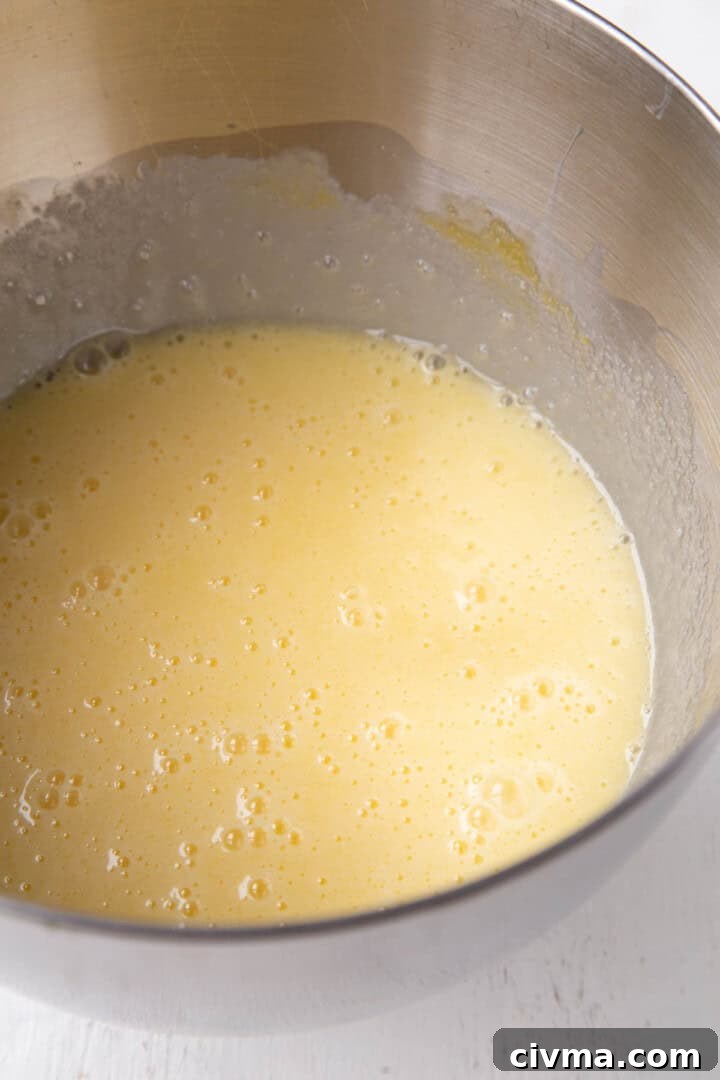yellow cake batter in a metal bowl.