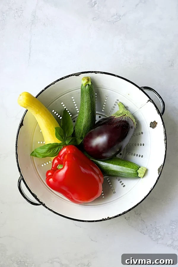 Photo of vegetables for tart in white colander.