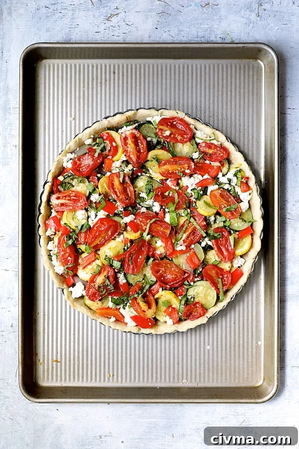Photo of vegetable-filled tart pan before being baked.