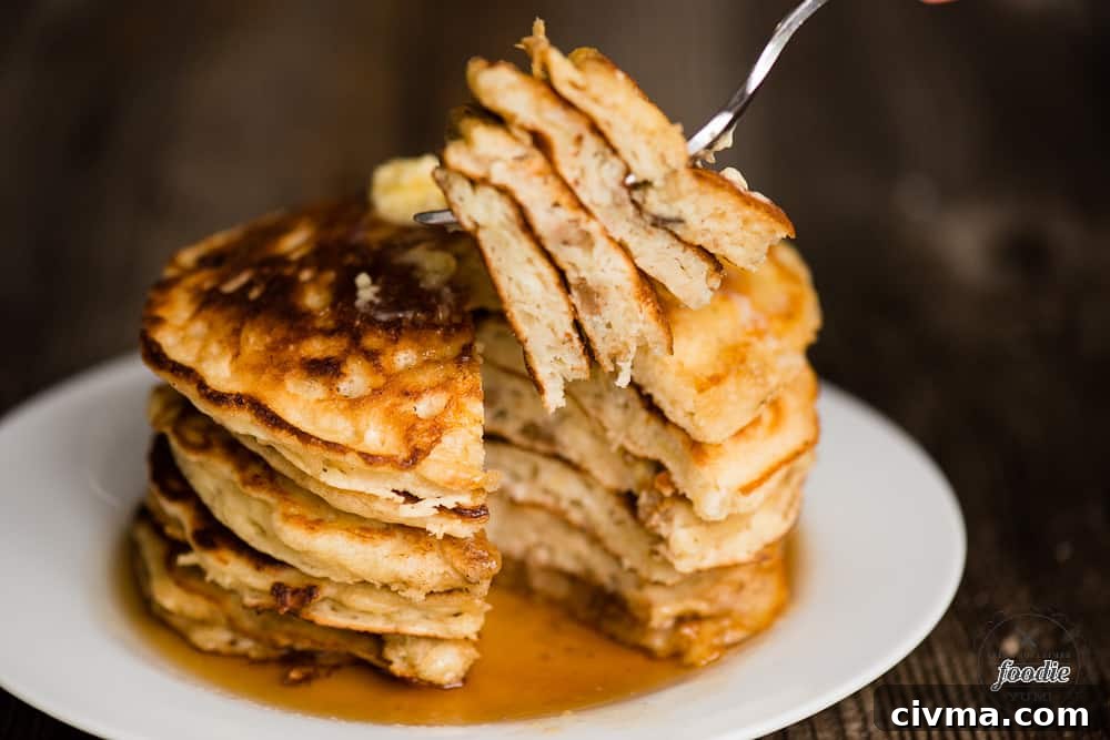 bite of four stacked banana pancakes