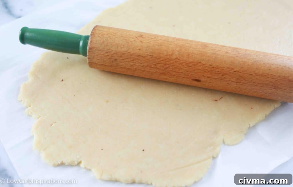 Brushing cinnamon butter on croissant dough