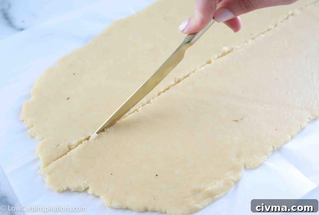 Rolling cinnamon croissants before baking