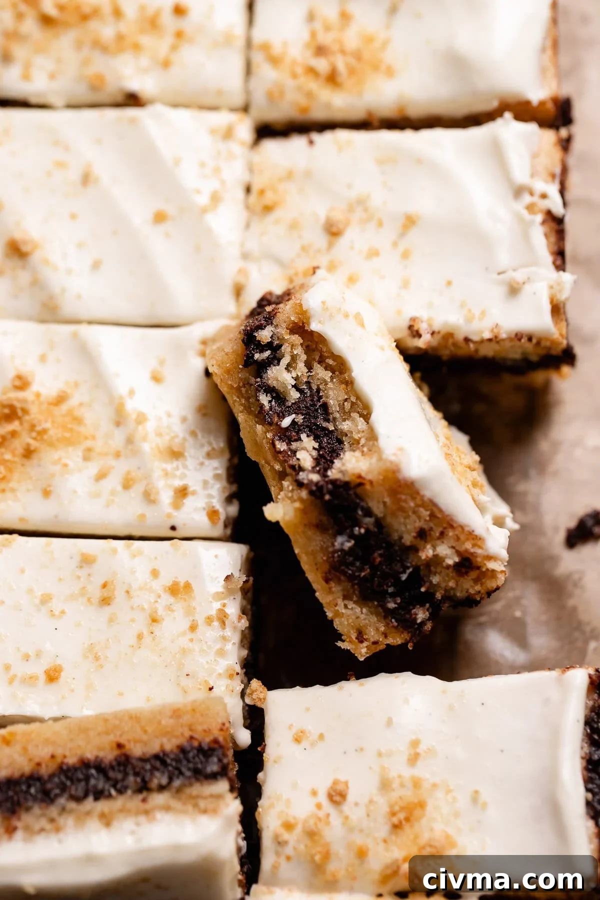 Soft Gooey Smores Cookie Bars Recipe 11 A single smores square leaning on the others missing a bite.