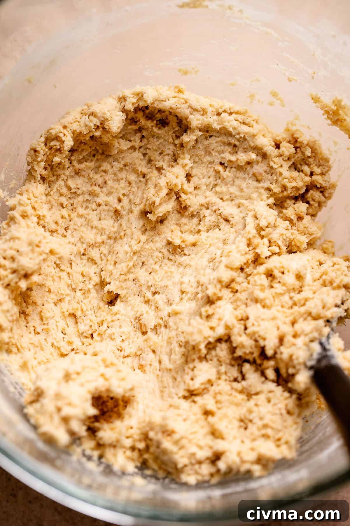 Soft Gooey Smores Cookie Bars Recipe 3 Graham cracker cookie dough in a glass stand mixer bowl.