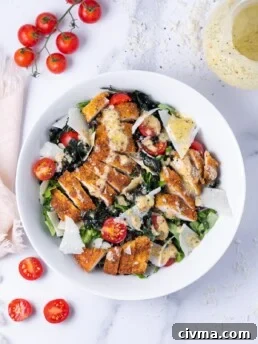 bowl with kale, tomatoes, parmesan, fried parmesan chicken