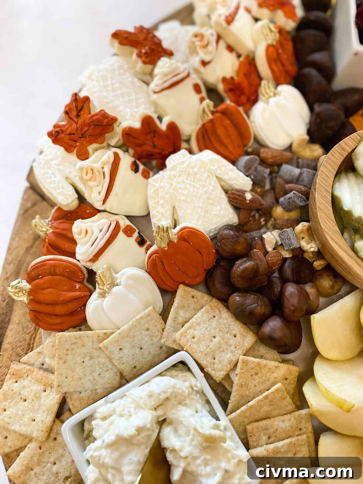 Create a Stunning Thanksgiving Charcuterie Board 5 Sweater, pumpkin and leaf cookies on a charcuterie board
