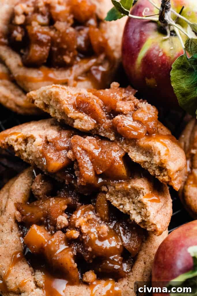 Salted Caramel Apple Pie Cookie Recipe 4 A close-up of an apple cookie broken in half.