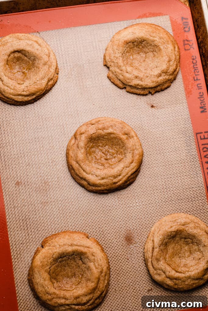 Salted Caramel Apple Pie Cookie Recipe 9 The baked cookies on a cookie sheet.