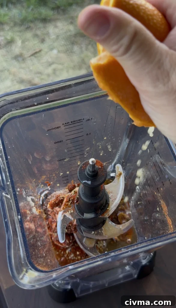Guajillo Ancho Orange Chili Shrimp Recipe 4 adding orange juice into the sauce