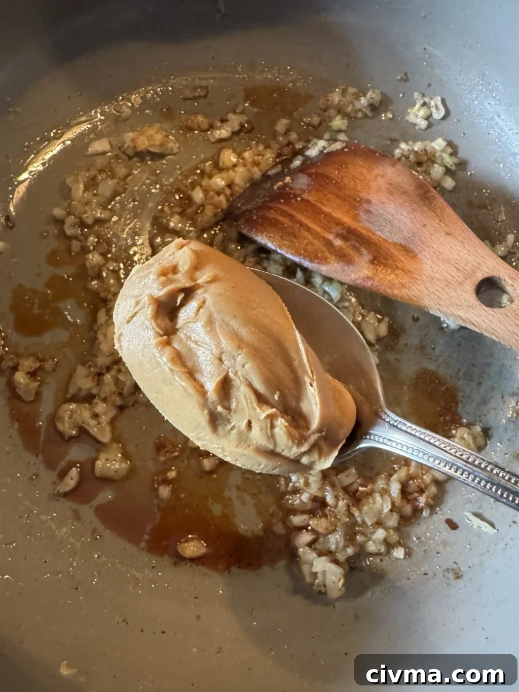 Guinness Dipping Sauce Recipe 5 A spoon of peanut butter over sizzling onions