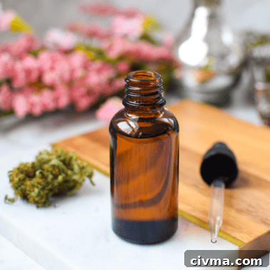 Full-Spectrum vs Broad-Spectrum CBD: Key Differences 11 A picture of a bottle of CBD oil with fresh cannabis buds.