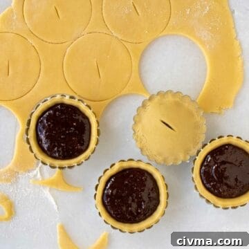 Bocconotti: Italian Chocolate-Almond Pastries from Puglia 11 Tartlet filled with chocolate, pastry rolled out and circles cut.