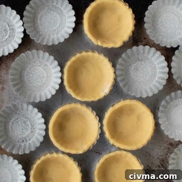 Bocconotti: Italian Chocolate-Almond Pastries from Puglia 10 Pastry lined tartlet tins with some tins unlined.
