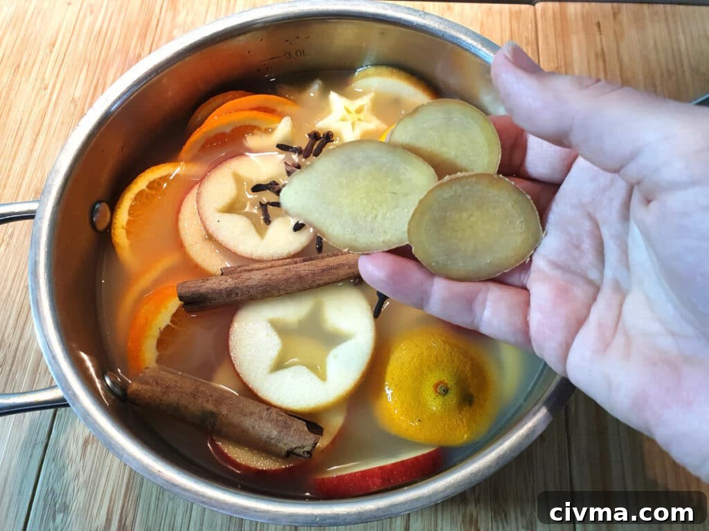 Adding sliced ginger to pot.