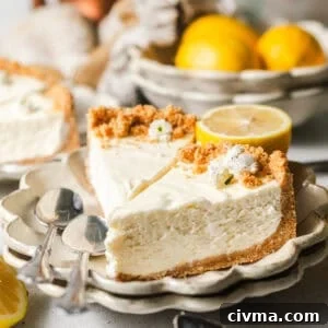 No Bake Lemon Icebox Pie with Graham Cracker Crust 11 sliced lemon icebox pie on a plate with lemons and spoons.