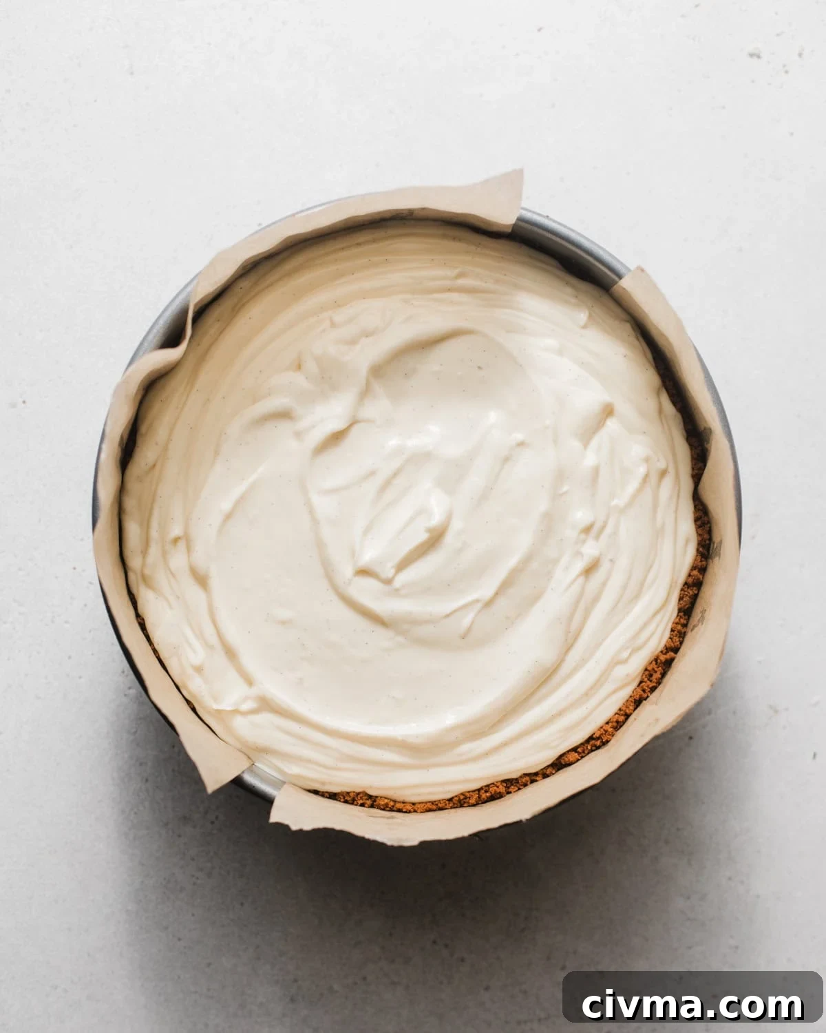 No Bake Lemon Icebox Pie with Graham Cracker Crust 8 lemon icebox pie in a springform pan lined with parchment paper.