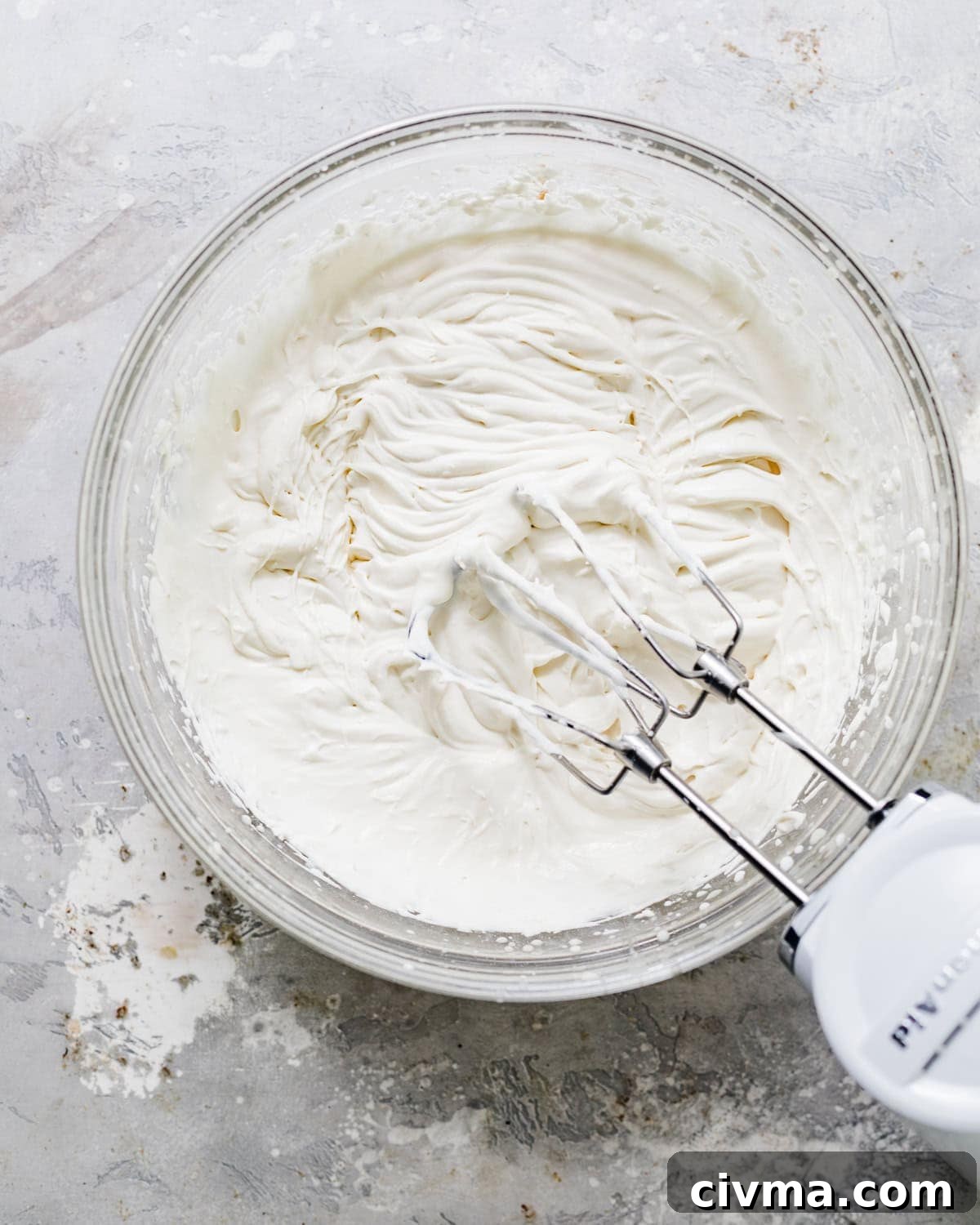 No Bake Lemon Icebox Pie with Graham Cracker Crust 9 lemon whipped cream in a bowl with an electric mixer.