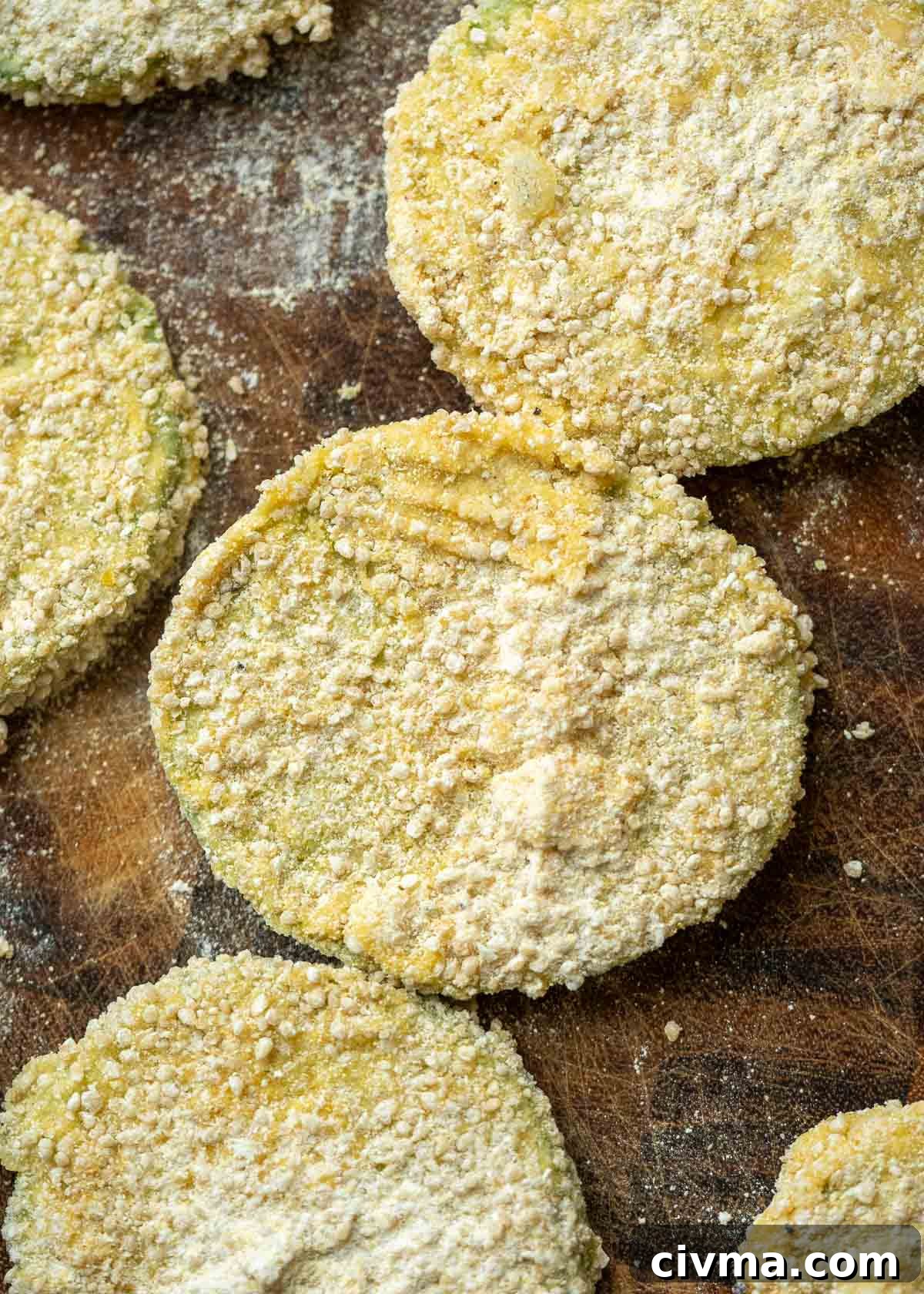 several slices of green tomato coated in a cornmeal breading